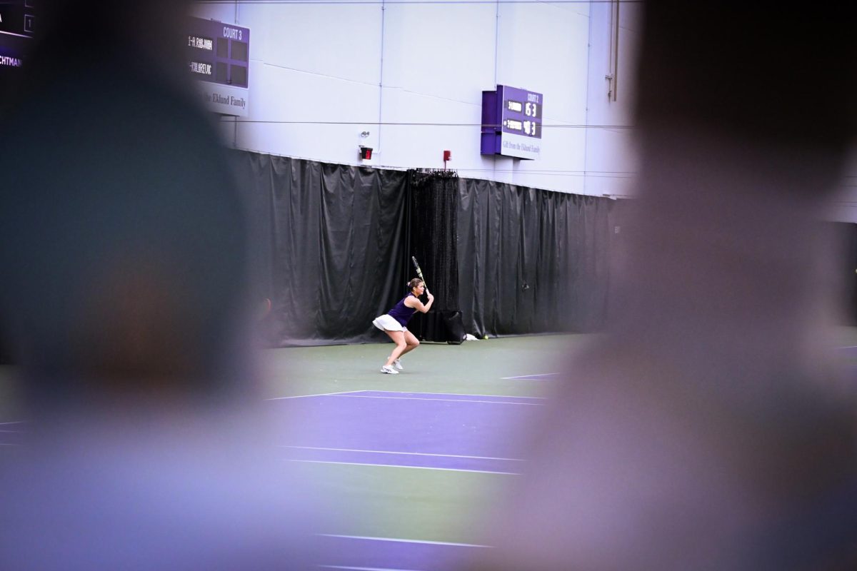 A tennis player prepares to hit a ball.