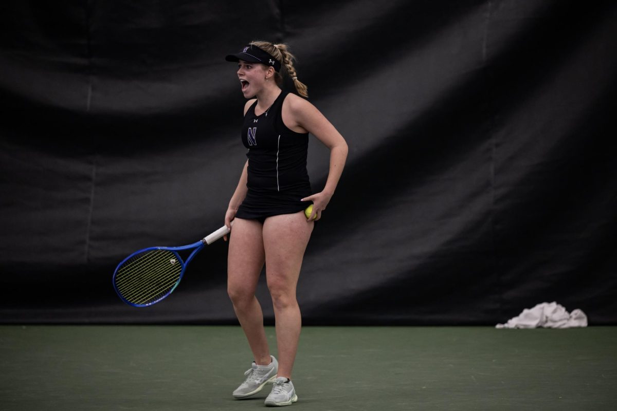 A Northwestern player screams to celebrate a point.