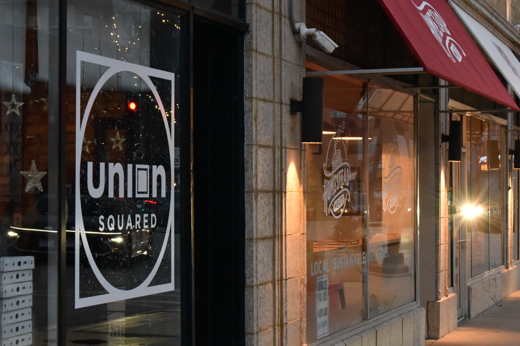 A storefront with a sign that says "Union Sqared."