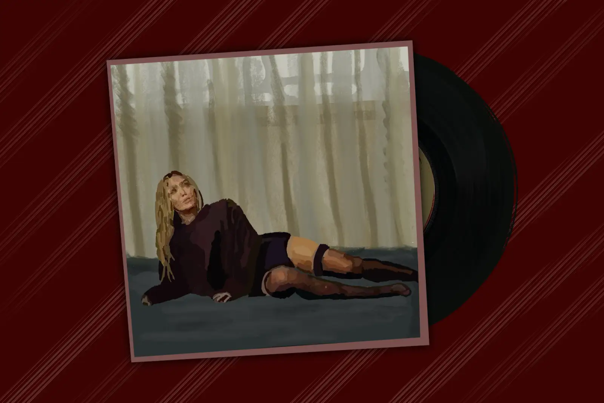 Album cover of woman laying on floor with pink vinyl record coming out of the cover.