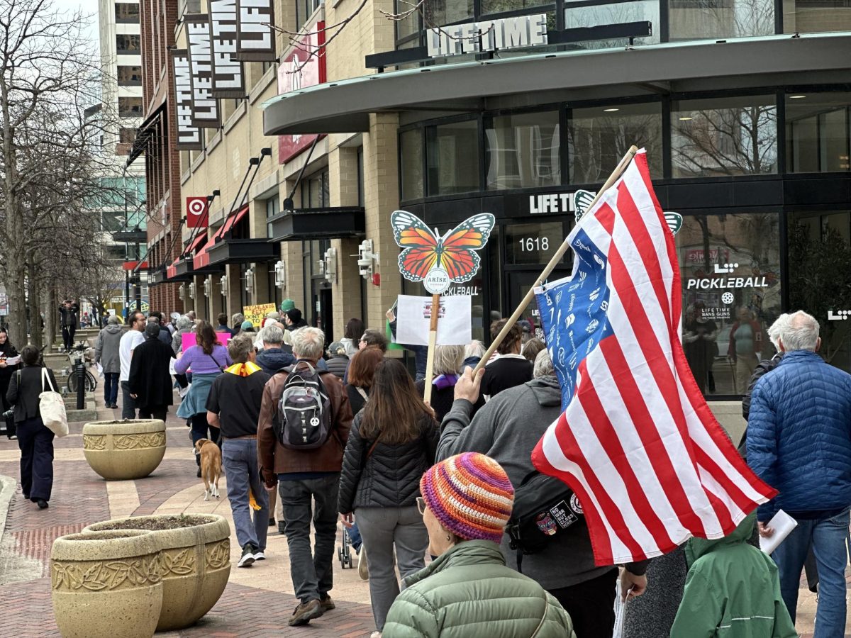 Clergy leaders and community activists marched around Sherman Plaza in downtown Evanston while singing songs originating from the national Singing Resistance movement. 