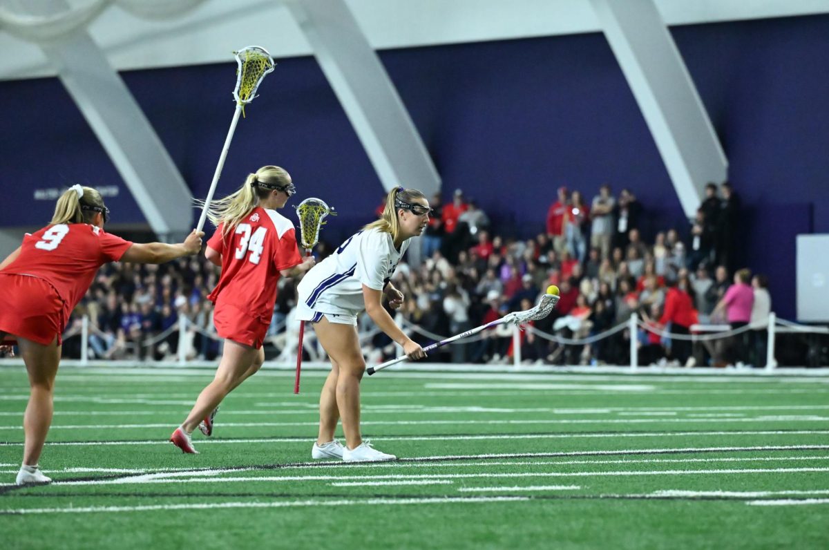 A player in a white jersey prepares to take a free position.