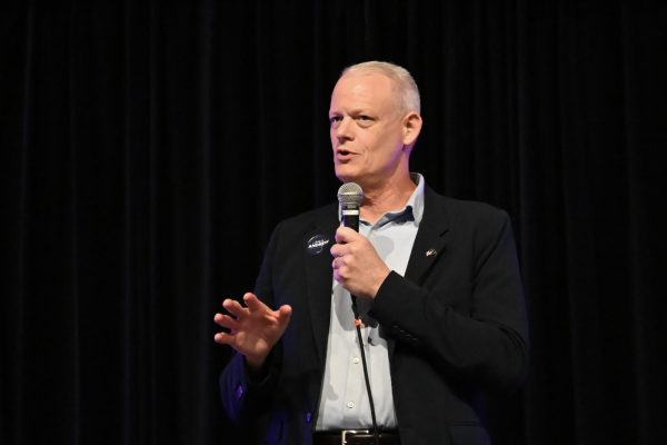 A man speaks into a microphone