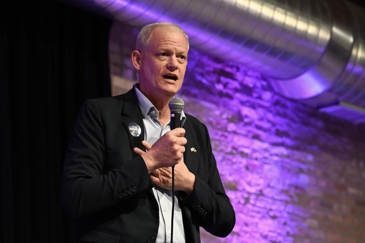 A person speaks into a microphone