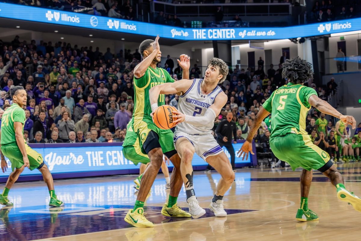 Senior forward Nick Martinelli pivots to throw up an improbable flip shot to beat Oregon 63-62 on Saturday night.
