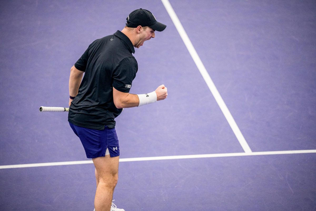 A player celebrates after winning a point.