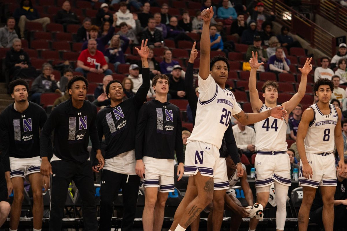 A player in a white jersey celebrates a 3-pointer while their teammates cheer.
