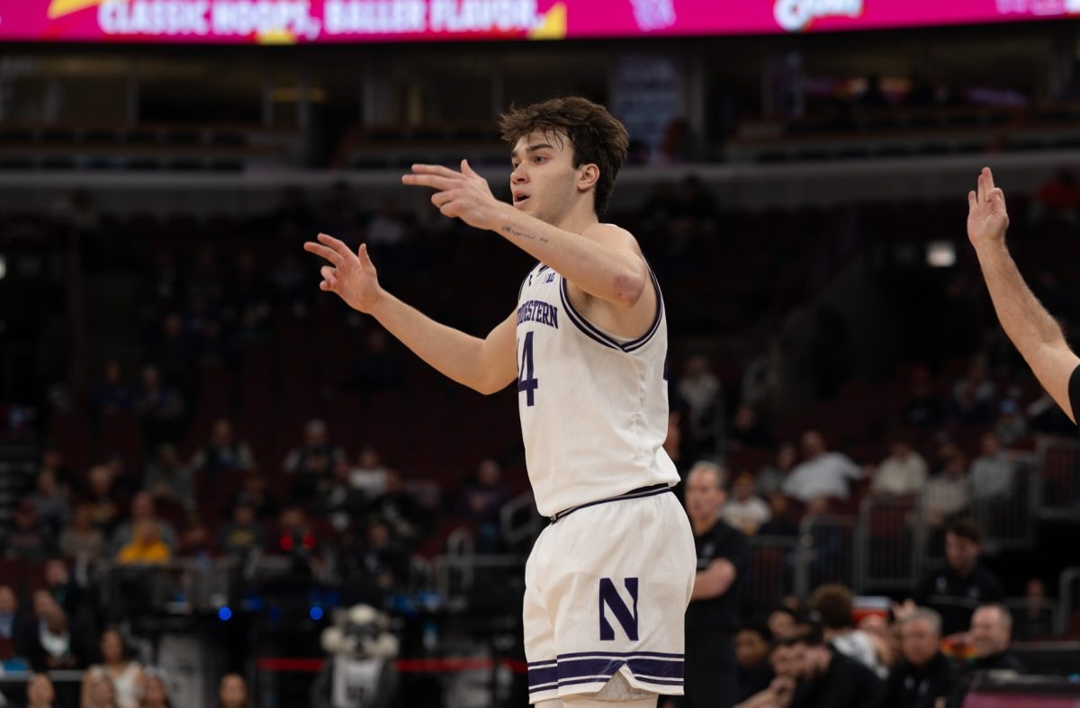 A player in a white jersey celebrates after making a shot.