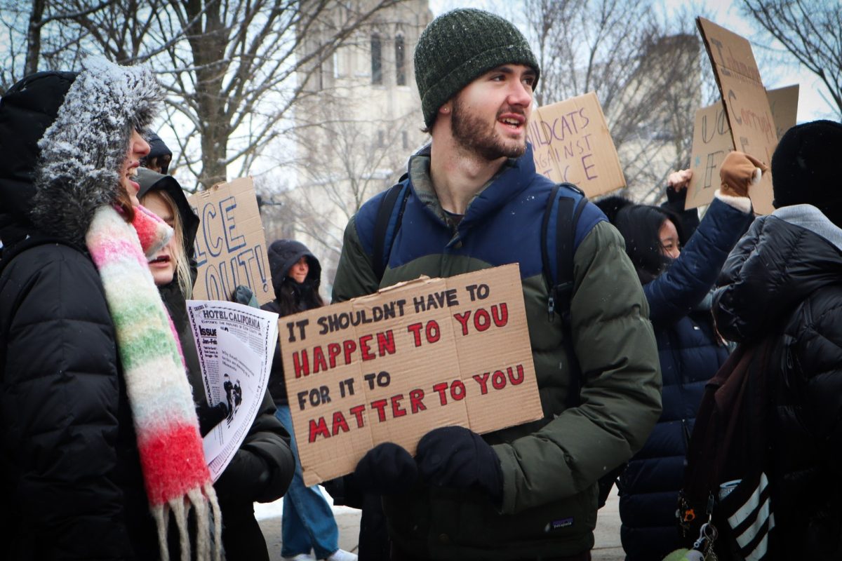 A protester carries a cardboard sign reading, &ldquo;It shouldn&rsquo;t have to happen to you for it to matter to you.&rdquo;
