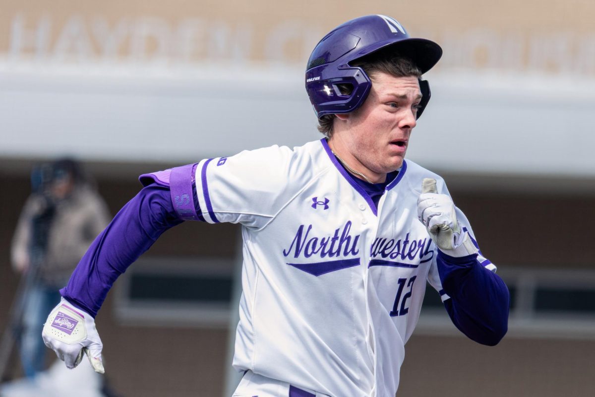Northwestern batter runs down the first base line.