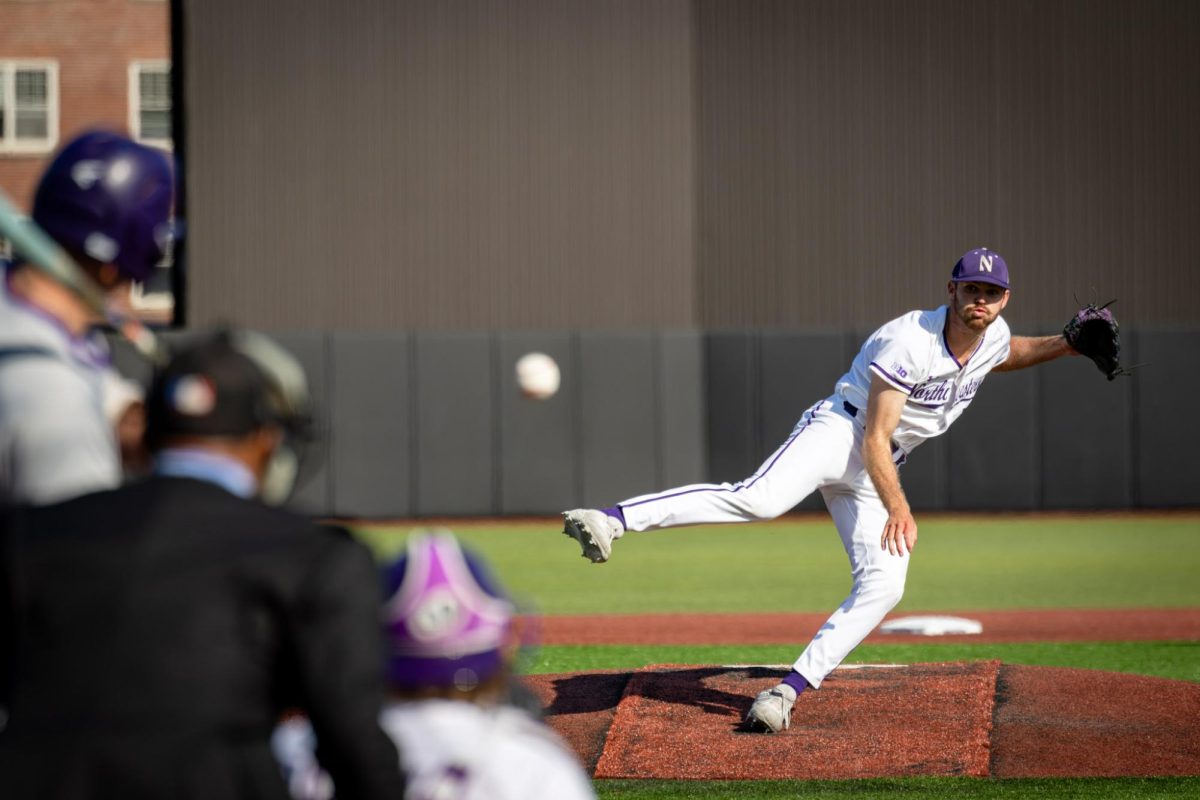 A baseball pitcher throws a ball.