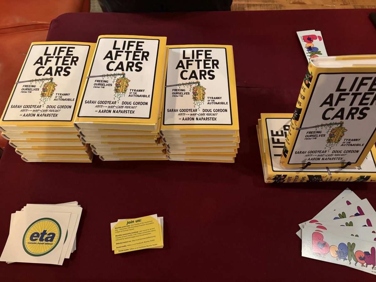 A few stacks of books on a table.