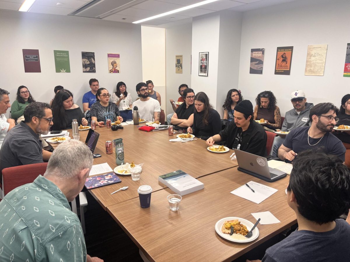 A group of people sitting around a table.