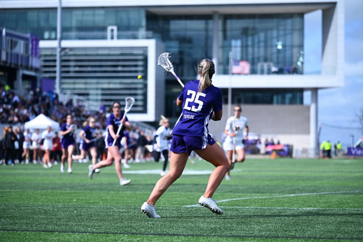 A person prepares to receive a ball from another.