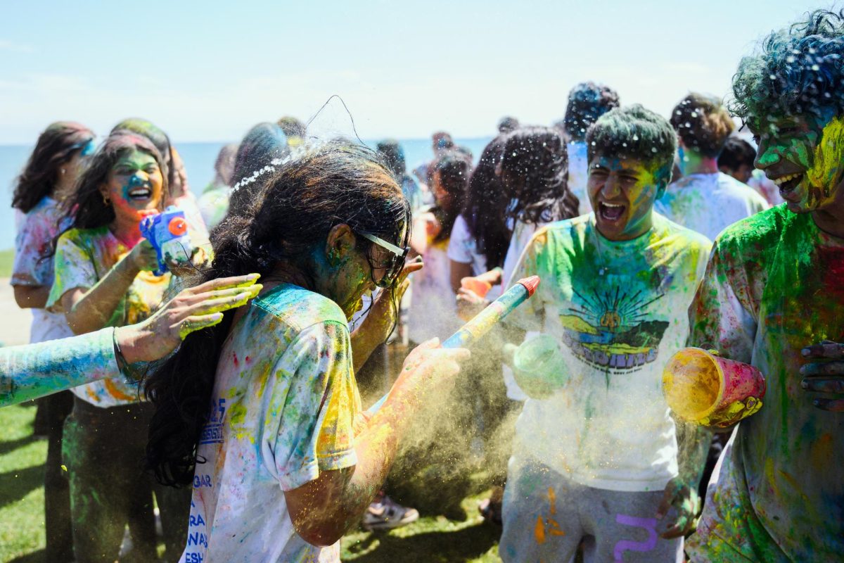 Students threw gulal, a colorful powder, in the air and on each other at the Northwestern South Asian Student Alliance’s Holi celebration.