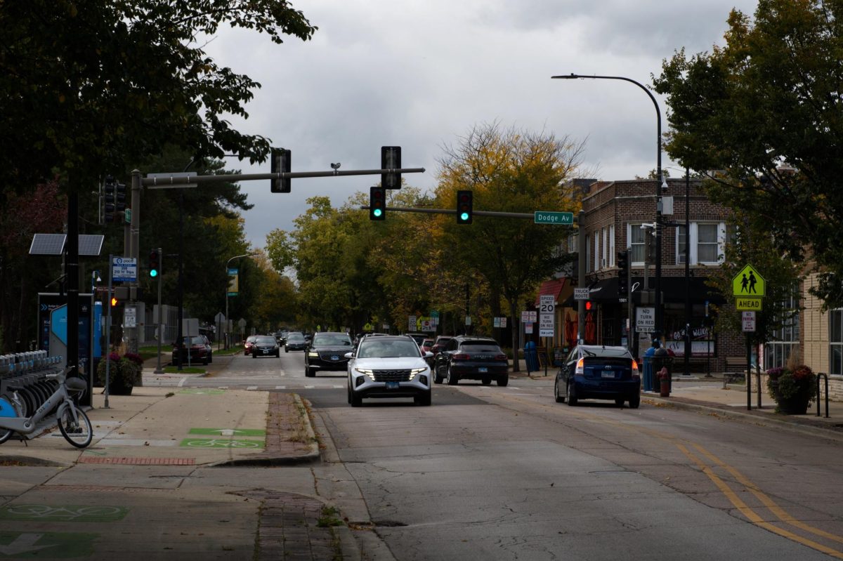 Cars driving down a street.