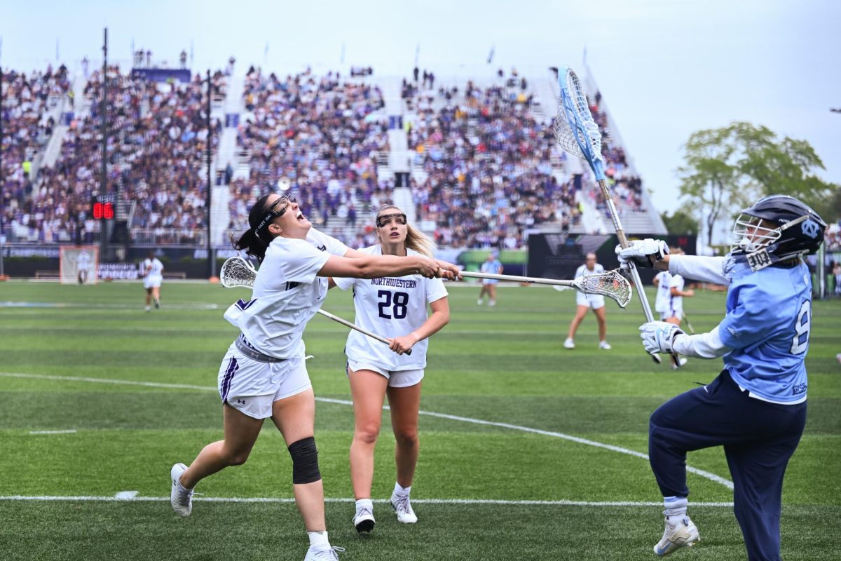 A player in white attempts to check a goalie in blue.