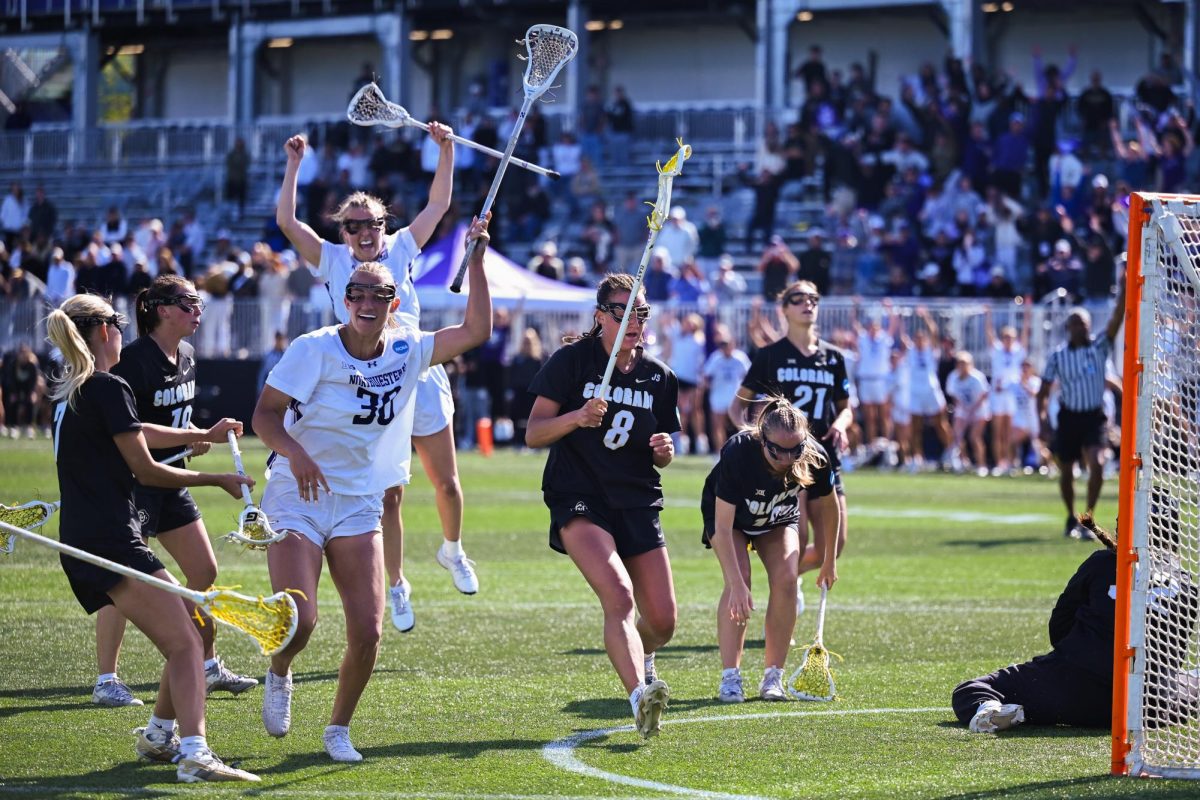 Players in white defend against a player in black.