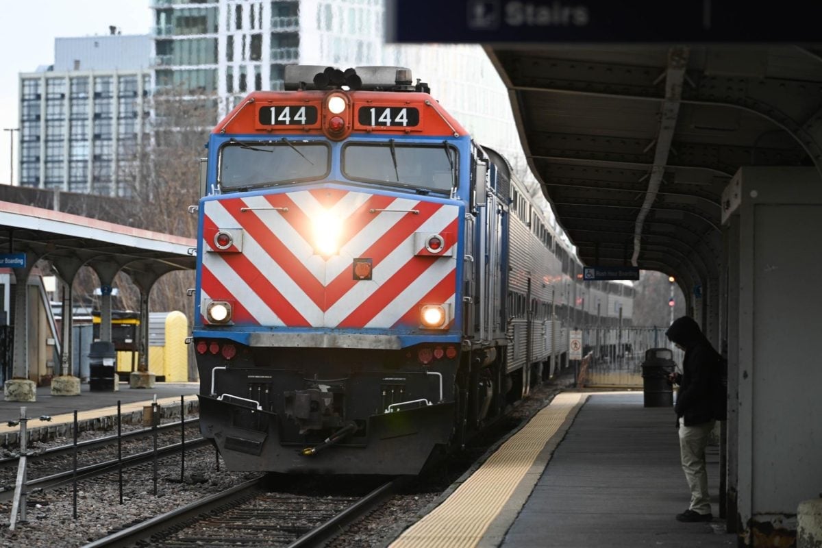 A Metra train arrives at the station.