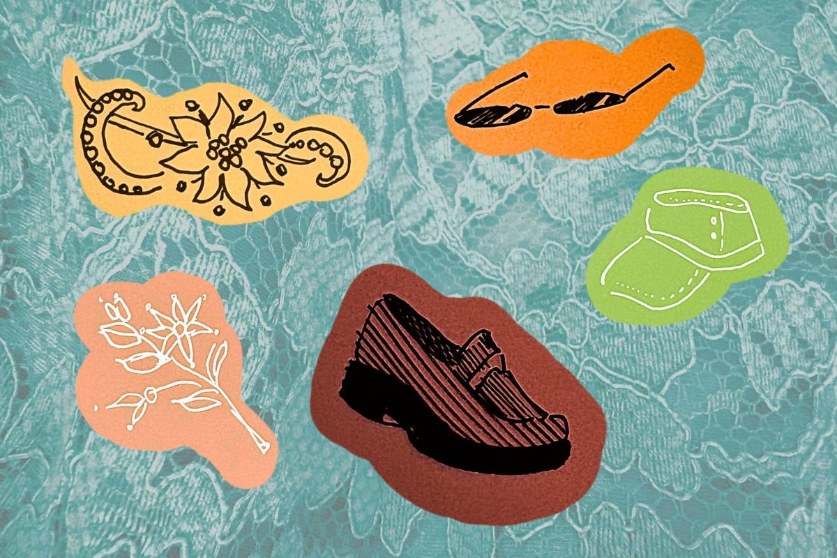 An assortment of fashion accessories are displayed in front of a blue lace background.