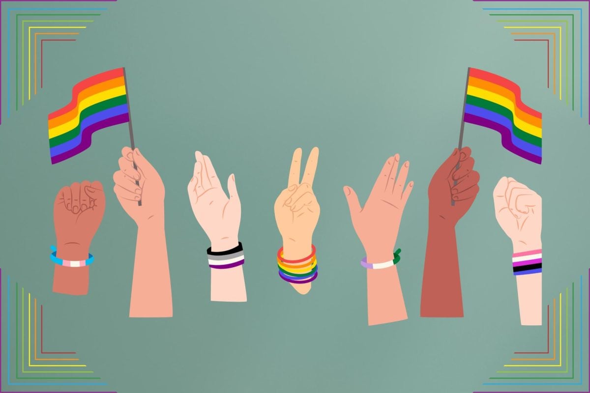 An illustration of hands holding pride flags.