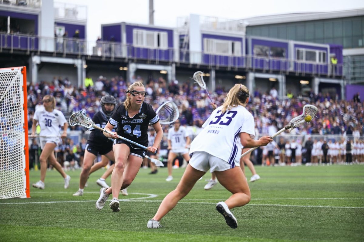 A player in white faces off against a player in black.