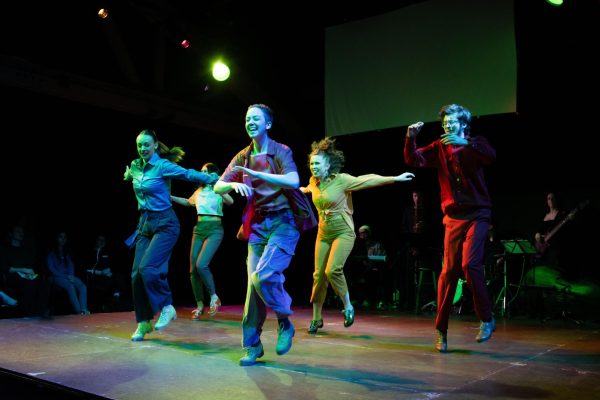 People tap dancing on a stage.