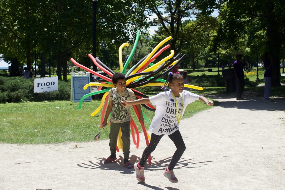 Two kids run on a path.