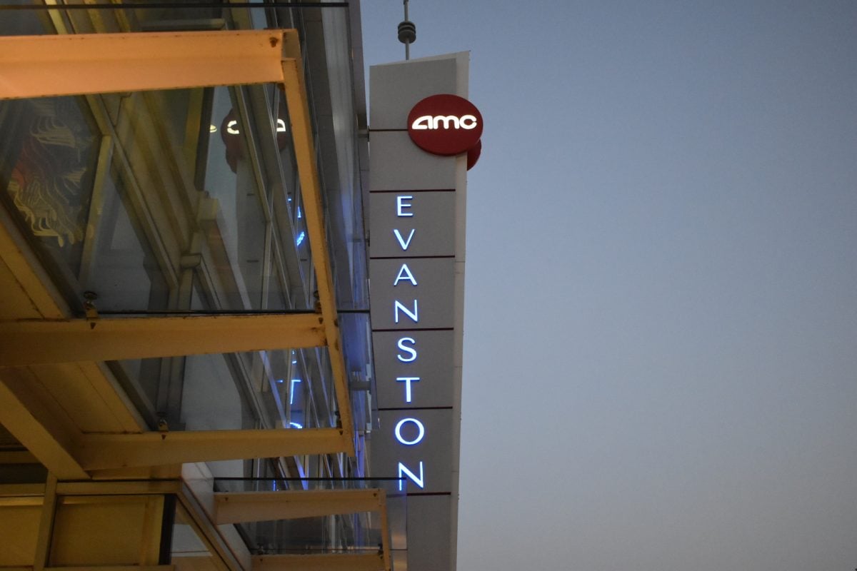 A photo of the AMC logo above a vertical lettering of “Evanston.”