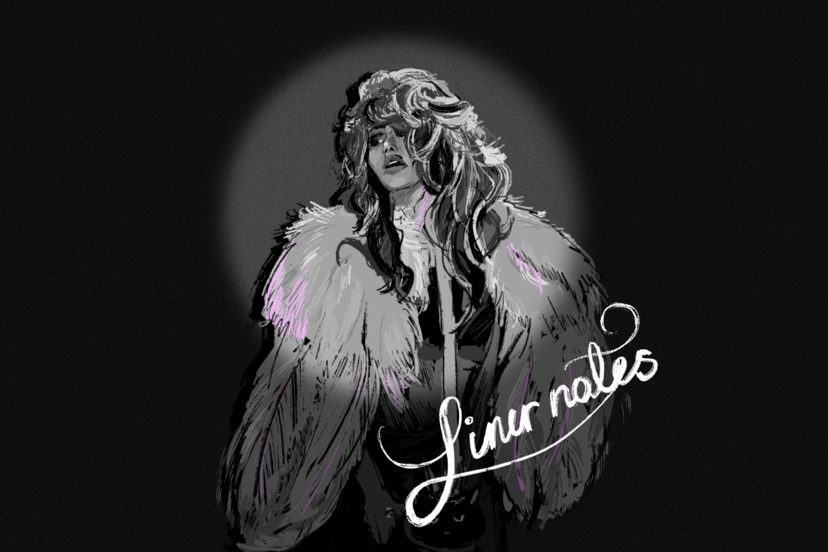 A spotlight shines on a person with long hair wearing a fur coat.