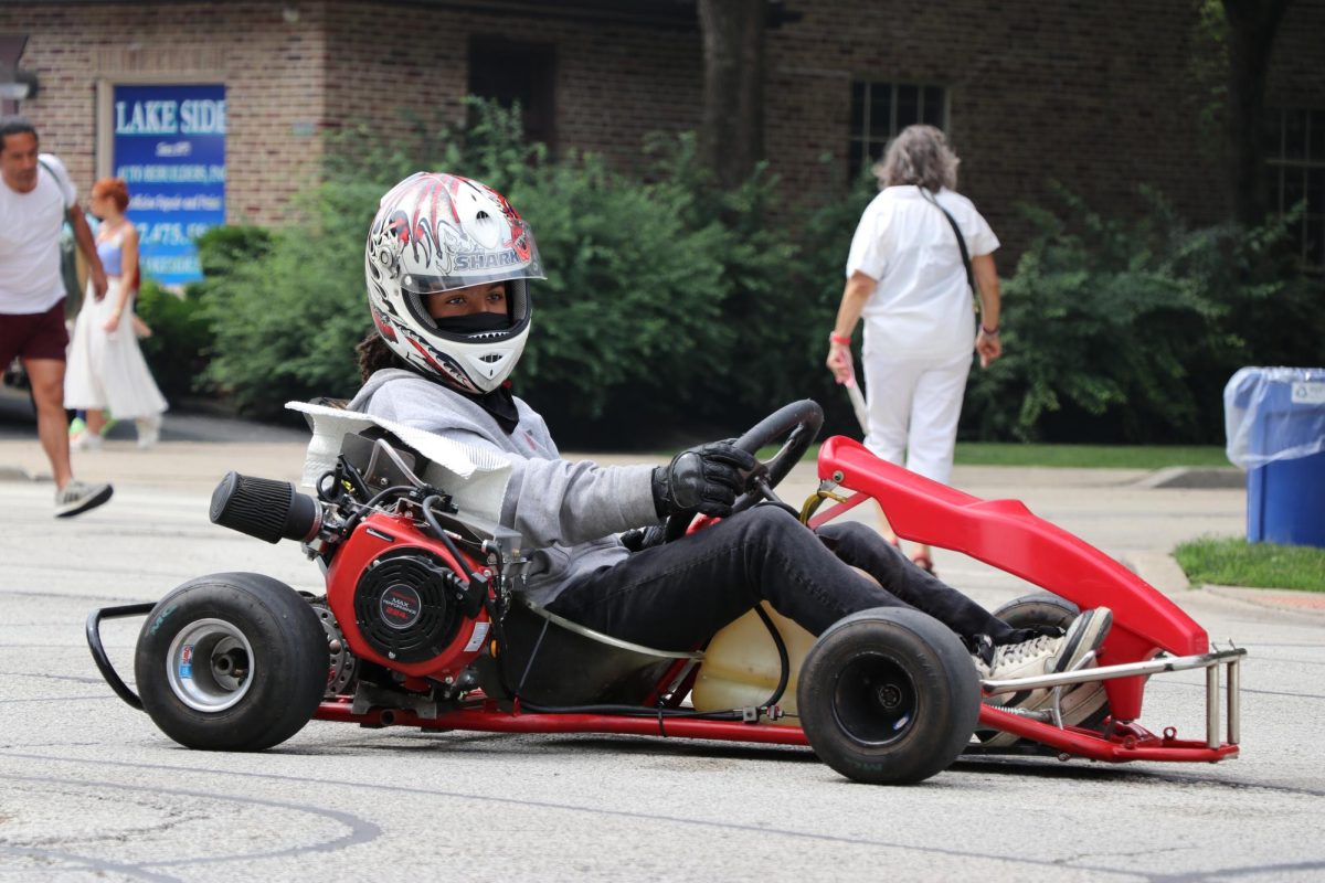 A child drives a small race car