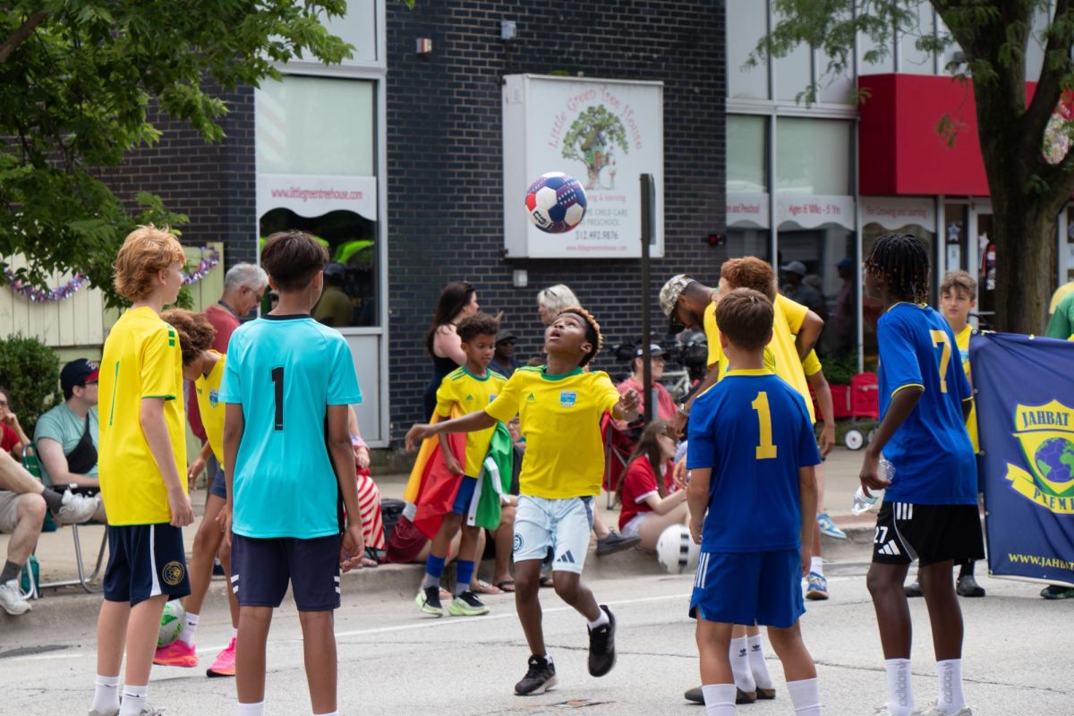 A group of children play soccer