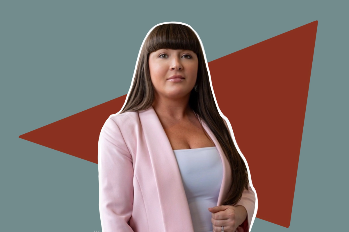 A person against a blue and red background.